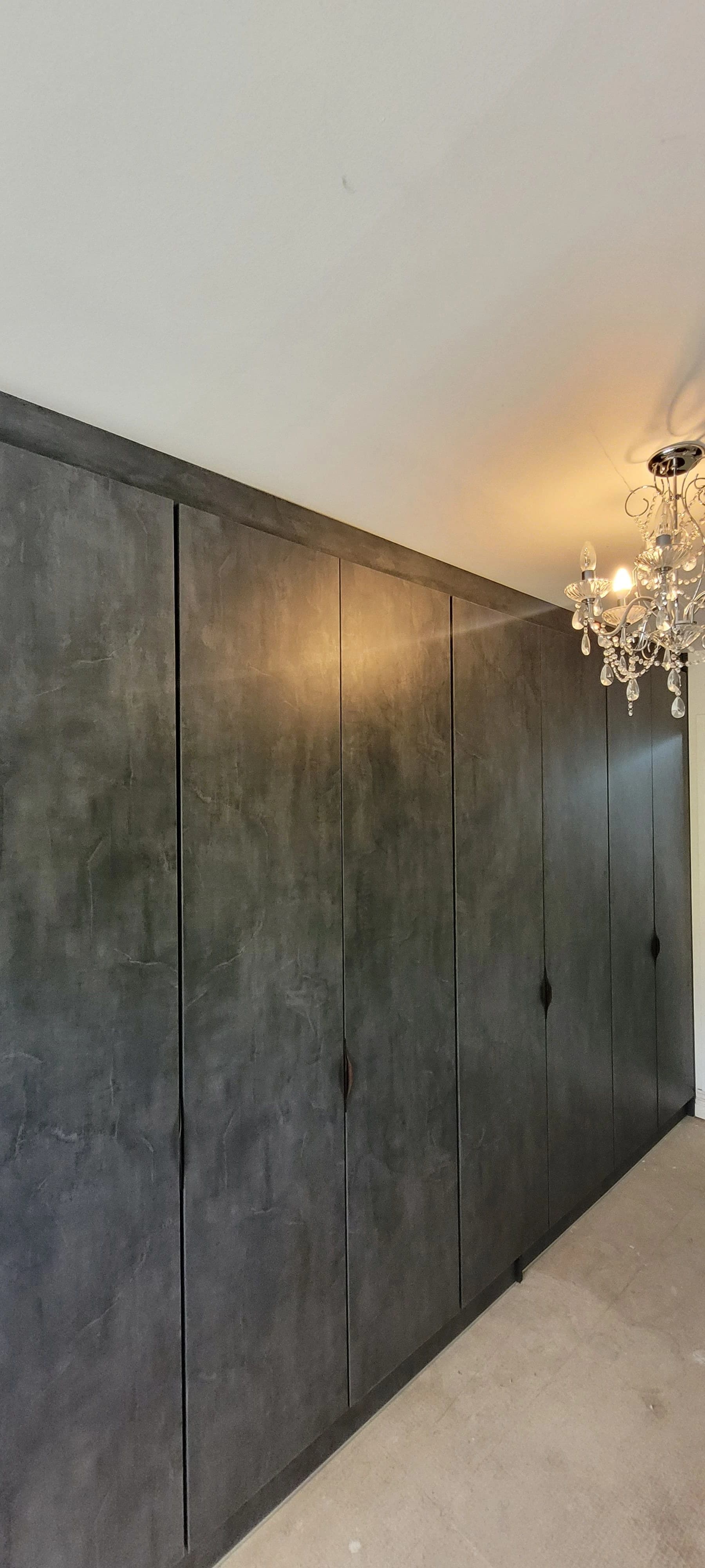 Dark concrete texture fitted wardrobe floor to ceiling