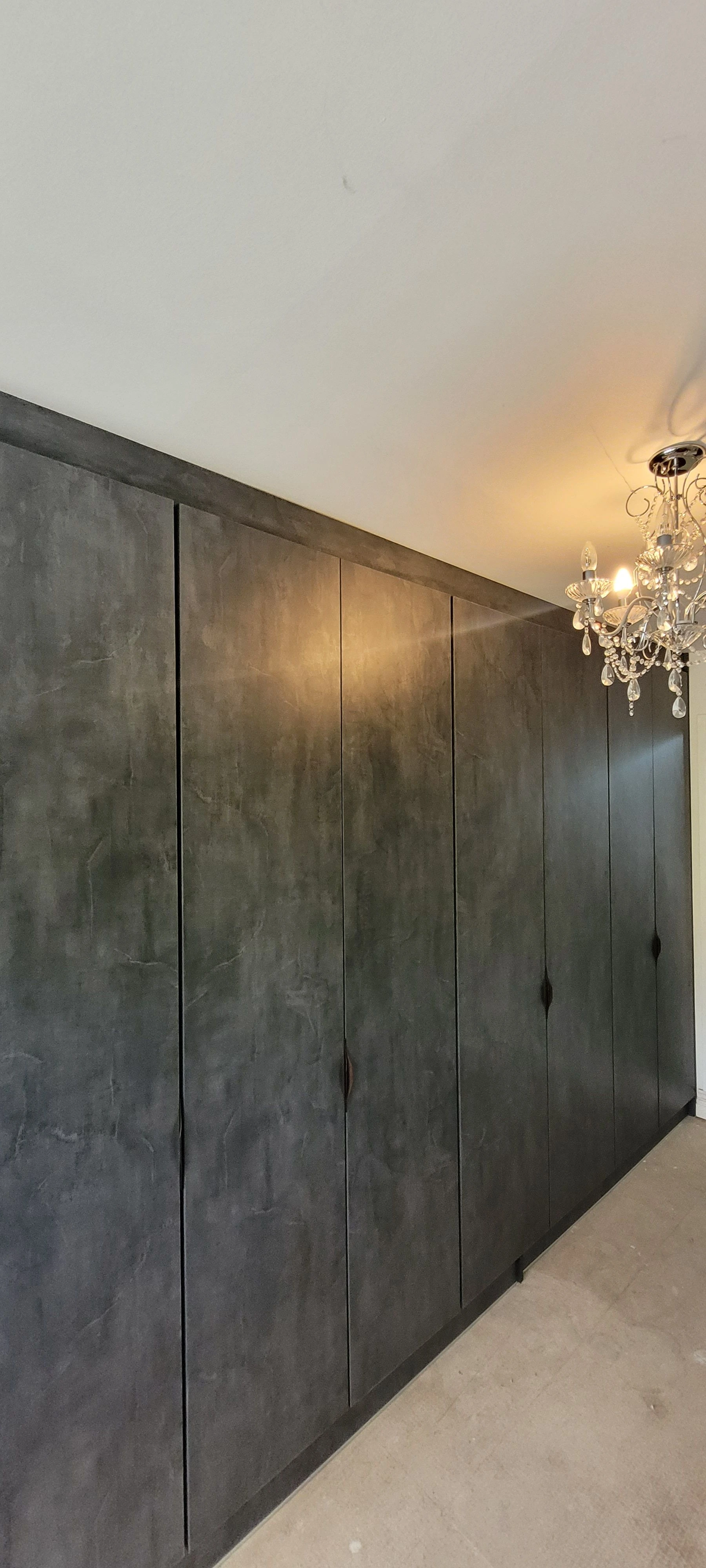 Dark concrete texture fitted wardrobe floor to ceiling